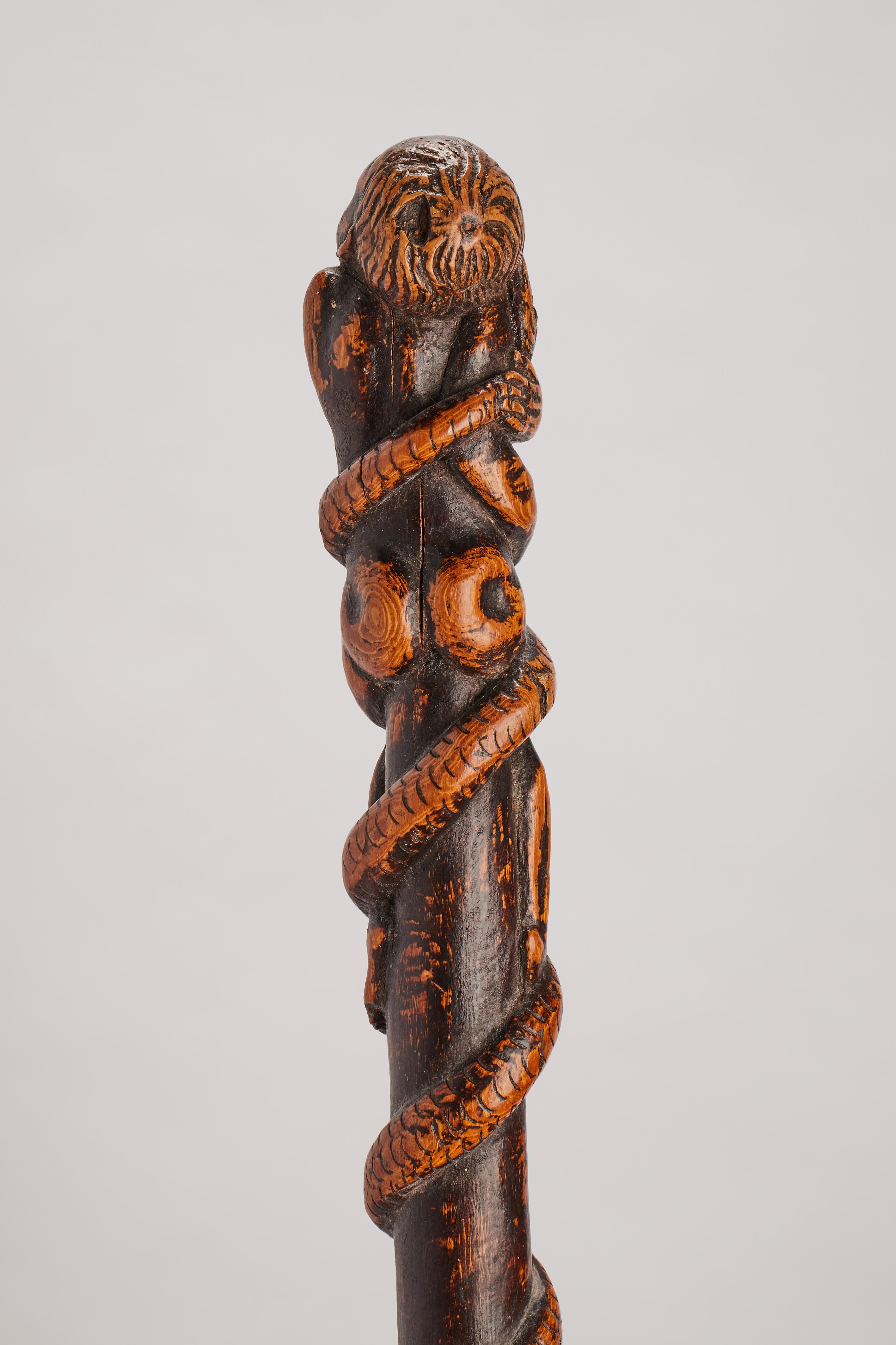 Boxwood folk art stick depicting a man with snake and lizard, Italy 1850.  For Sale 2