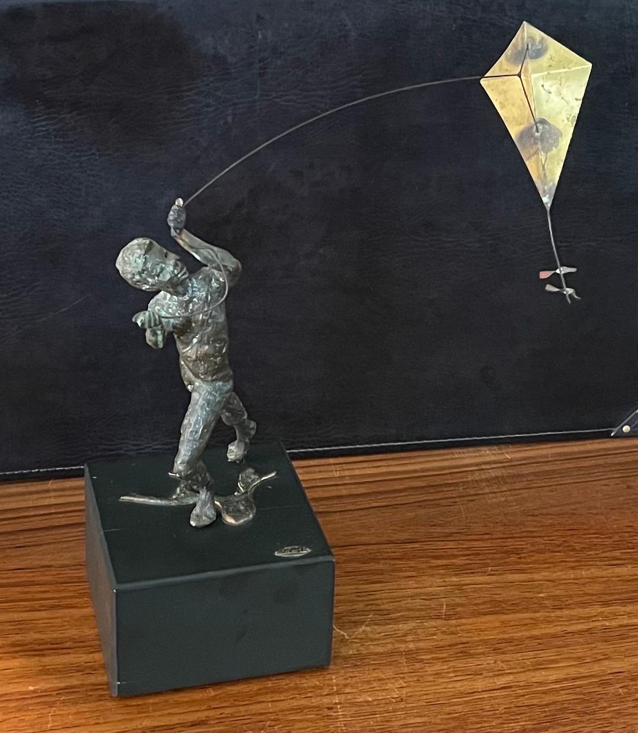 Mid-Century Modern Boy Flying Kite Bronze on Wood Block Sculpture by Curtis Jere For Sale