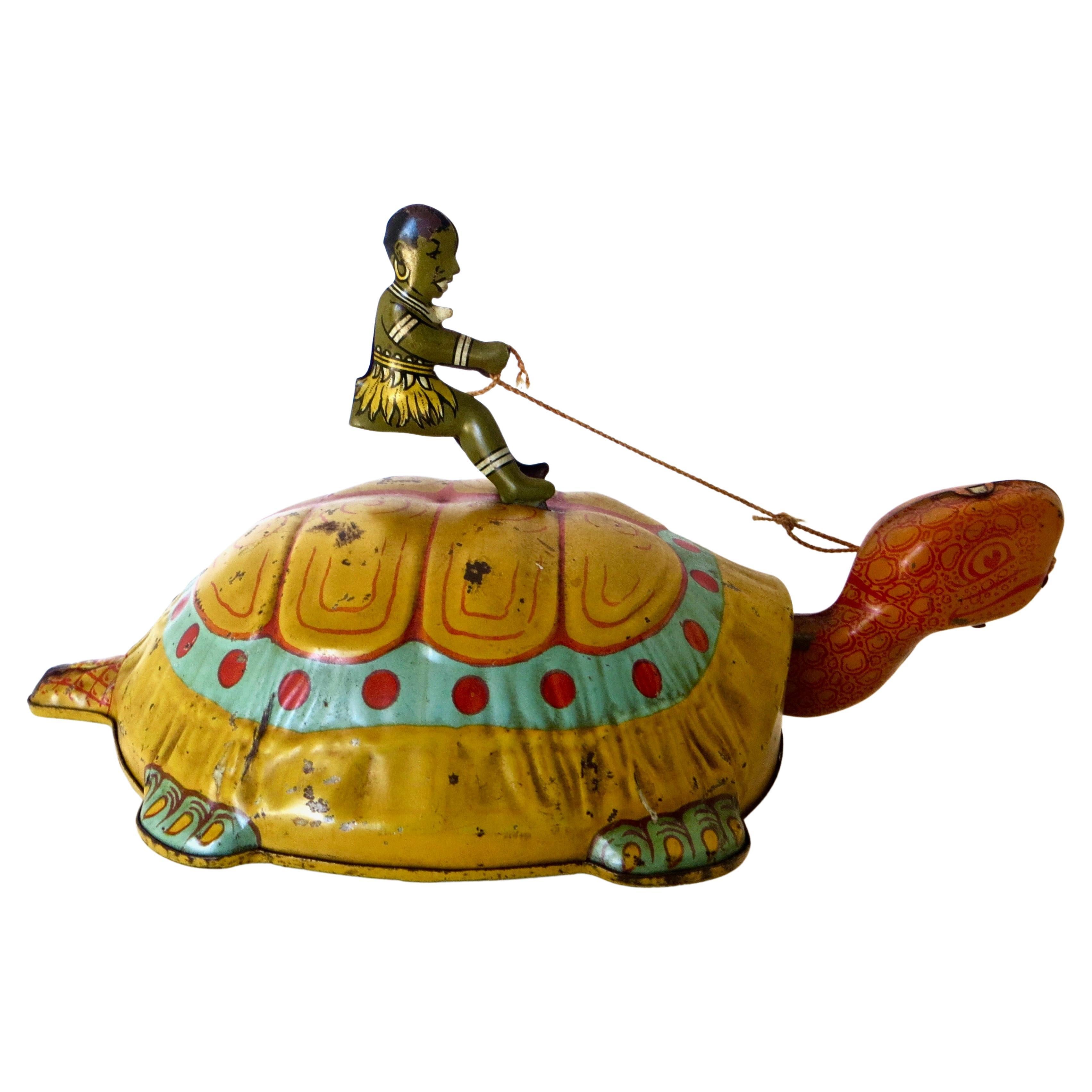 Aufziehbares Spielzeug "Junge reitet auf einer Schildkröte"; von J. Chein, ca. 1930er Jahre