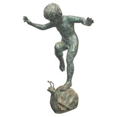 Boy Riding Snail Bronze Statue