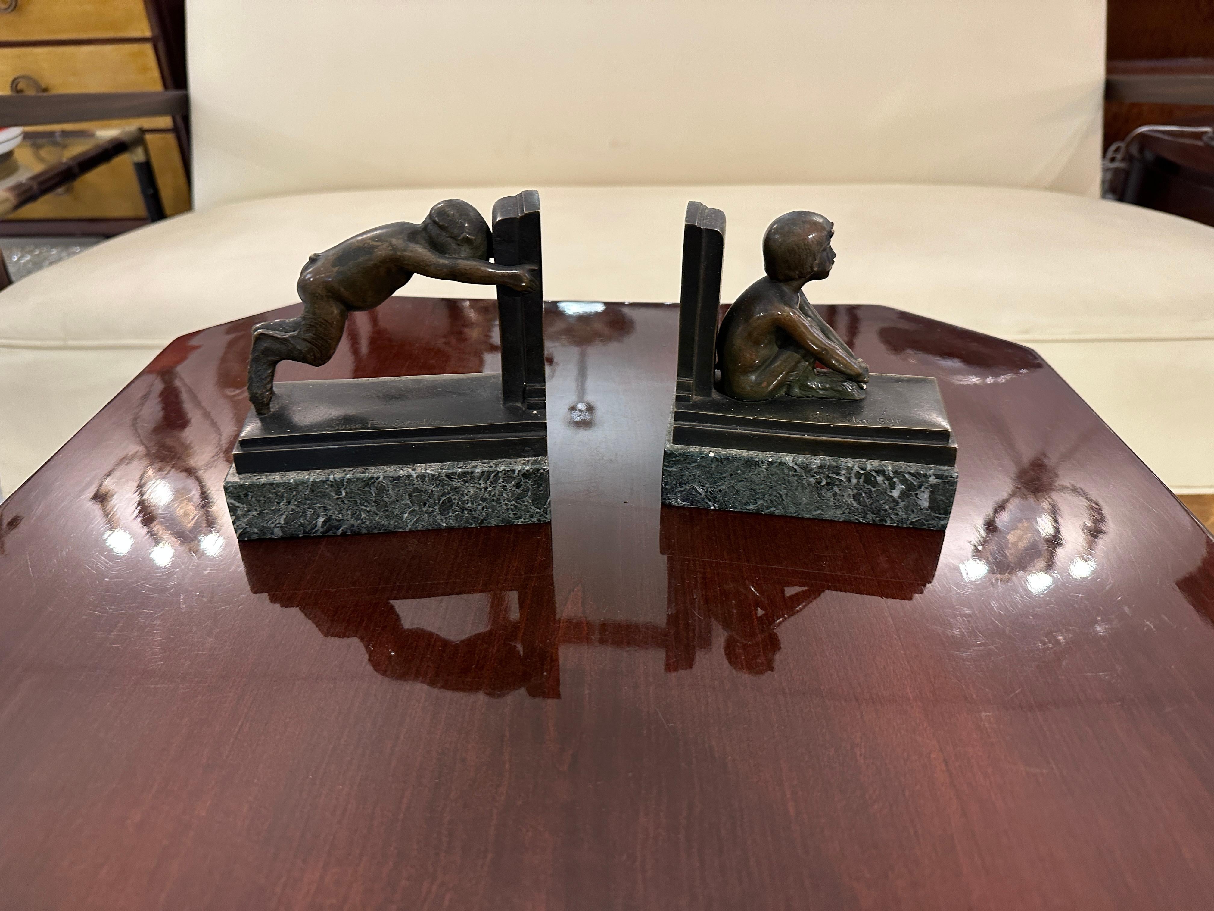 Bronze Boys Bookends in bronce and Marble, France , Style: Art Deco For Sale