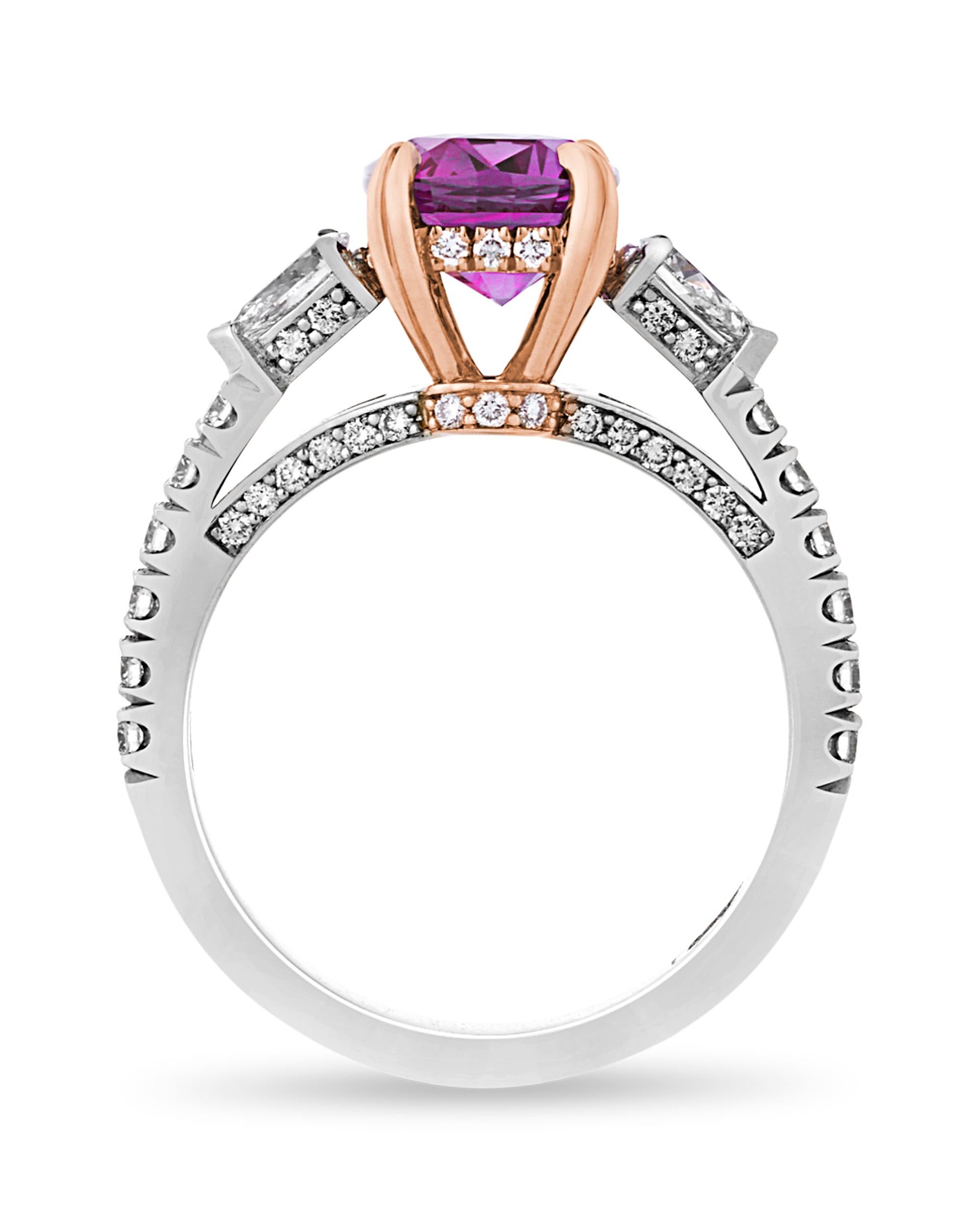 This breathtaking ring dazzles with a rare purple-hued “boysenberry” sapphire totaling 3.26 carats as its centerpiece. Stunning white diamonds totaling 0.84 carat surround the band, adding sparkle to this phenomenal sapphire. Taking its name from