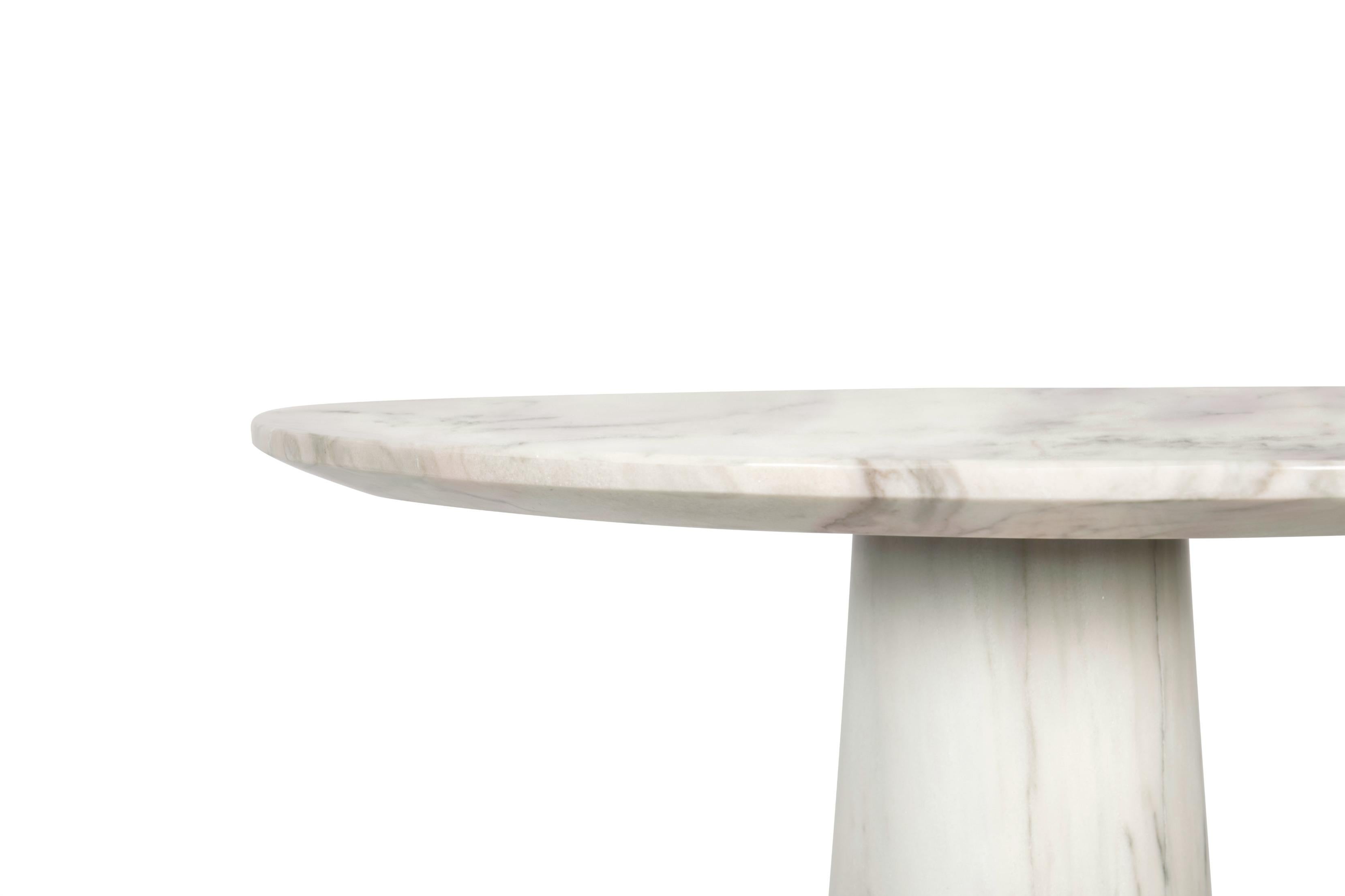 Agra is the modest setting of one of the most famous monuments in the world, Taj Mahal, also known as the marble mausoleum. Just like it, AGRA Bar Table is an impressive display of craftsmanship and elegance. Made of Estremoz marble with polished