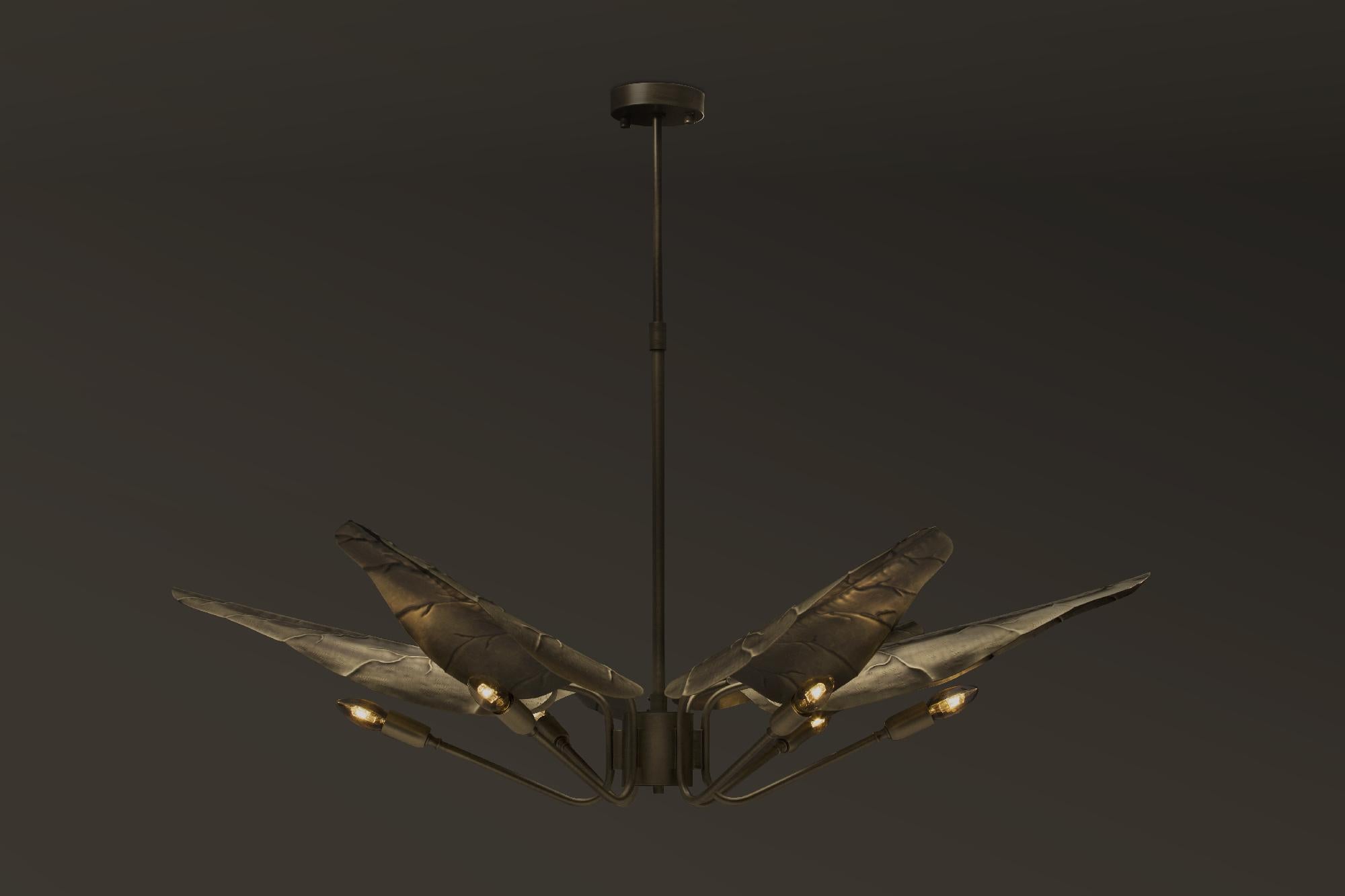 With origins in South Africa, Calla lily flower is one of the most graceful things nature has conceived. Inspired by its delicacy, our design team created Calla suspension light. With a gracefully aged brass top in the shape of elegant leafs, the