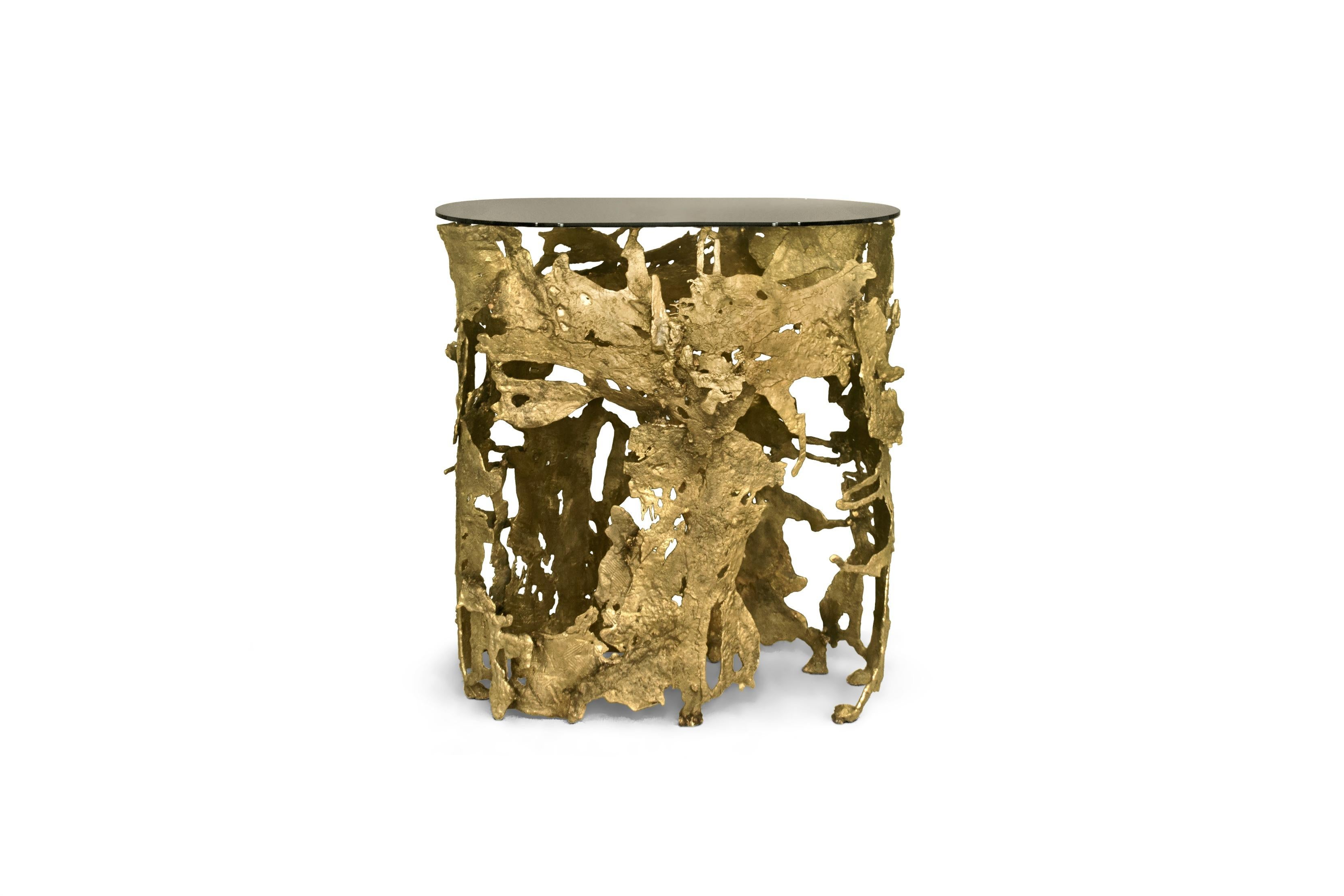 Nature in its rawest form flows through CAY Console Table as lava flows during a volcano eruption. With a table top in bronze glass and a base in casted brass, this entryway console table embodies Nature’s ultimate scream.
Table top in bronze glass