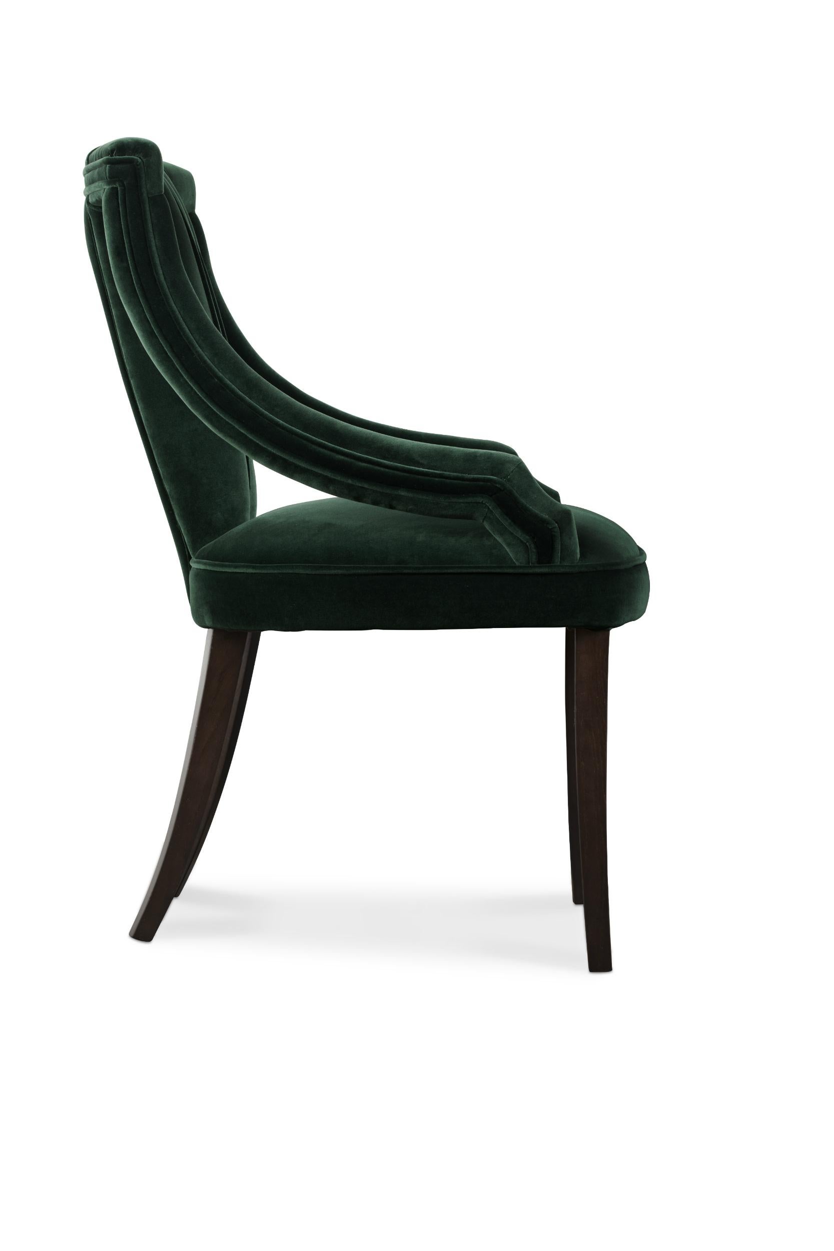 Modern Cayo Dining Chair in Cotton Velvet with Wood Legs by Brabbu
This modern dining chair, Cayo is an elegant and luxurious seating chair by Brabbu in green and forest tones made in velvet. This modern dining chair is perfect for any dining room