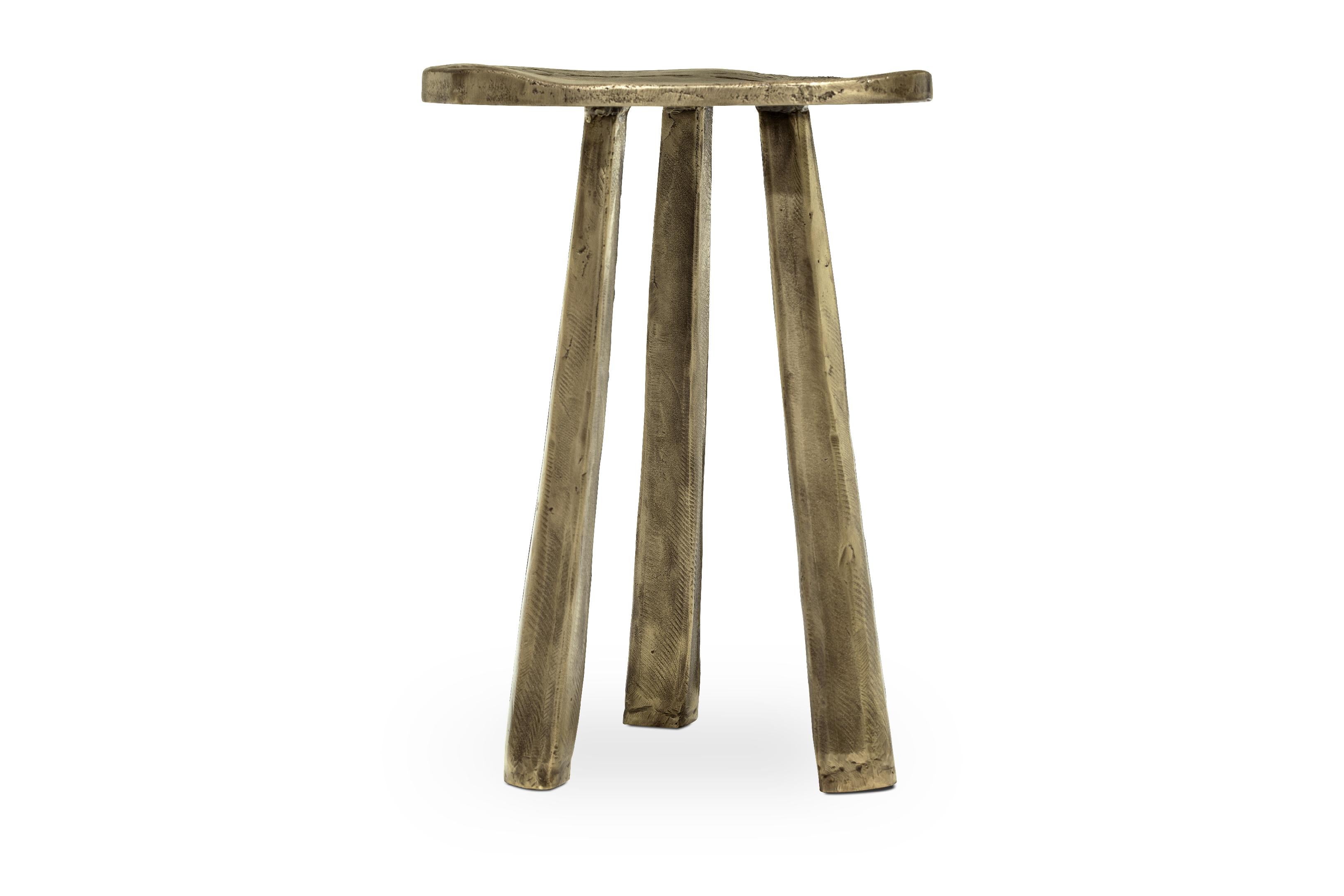 Dolmens are megalithic tombs that usually consist of upright stones supporting a large flat horizontal one. The impressive structure inspired the creation of Dolmen stool, a unique furniture design piece. This brass stool, with three legs & made of