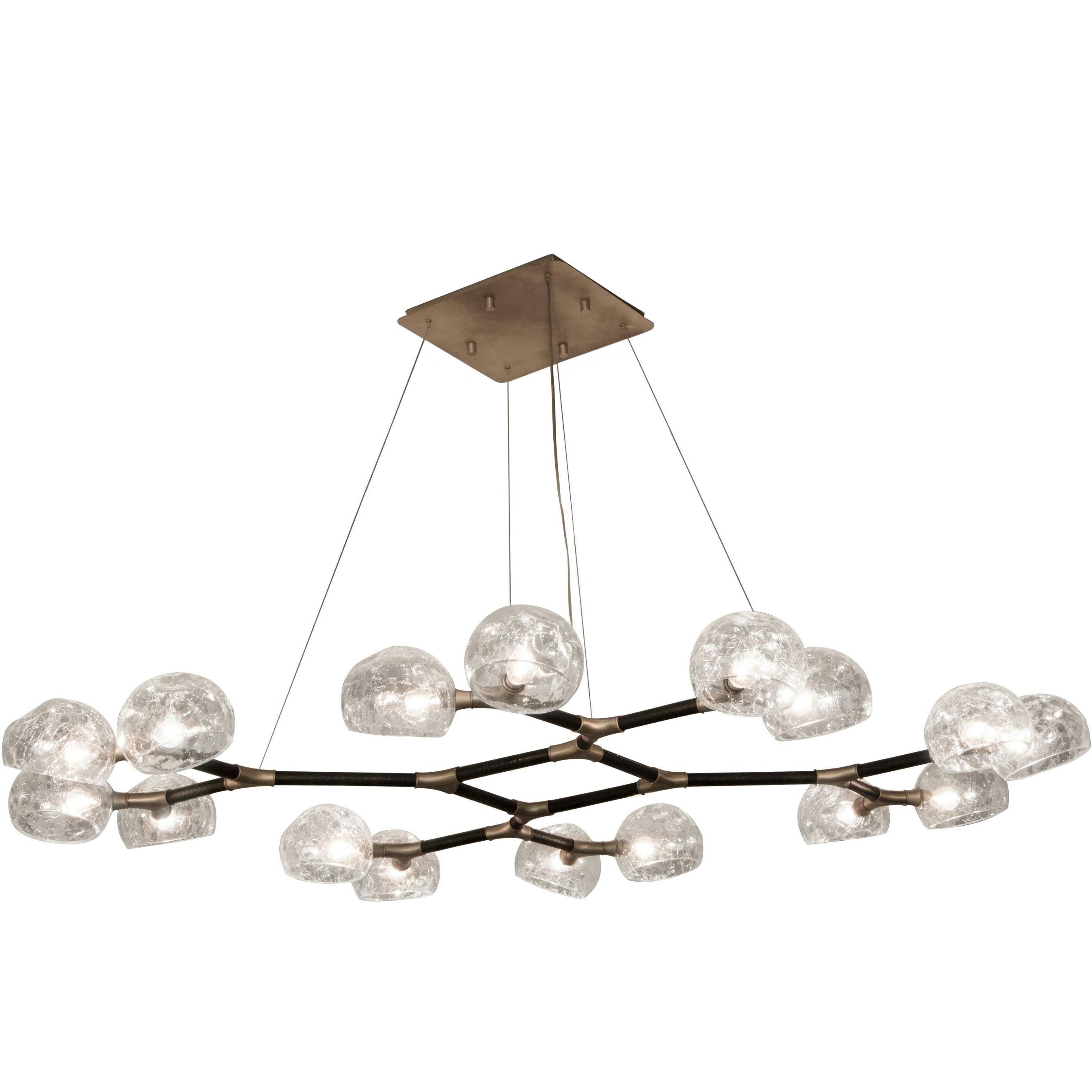 Just like the God of the sky and the rising sun, HORUS Glass Suspension Light II promises to be a reference in modern interior design. Featuring a structure in matte black lacquered brass and shades in matte brass, this chandelier is perfect for
