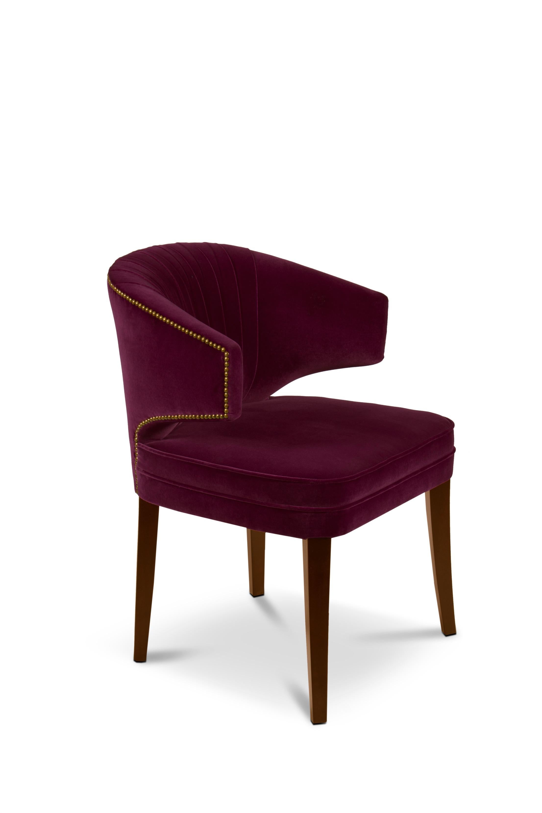 Ibis are beautiful birds known for their long slim legs. Just like IBIS dining chair, an elegant seating solution. Upholstered in cotton velvet, this velvet dining chair with an aged brass nailhead trim will be the focal point of any dining room