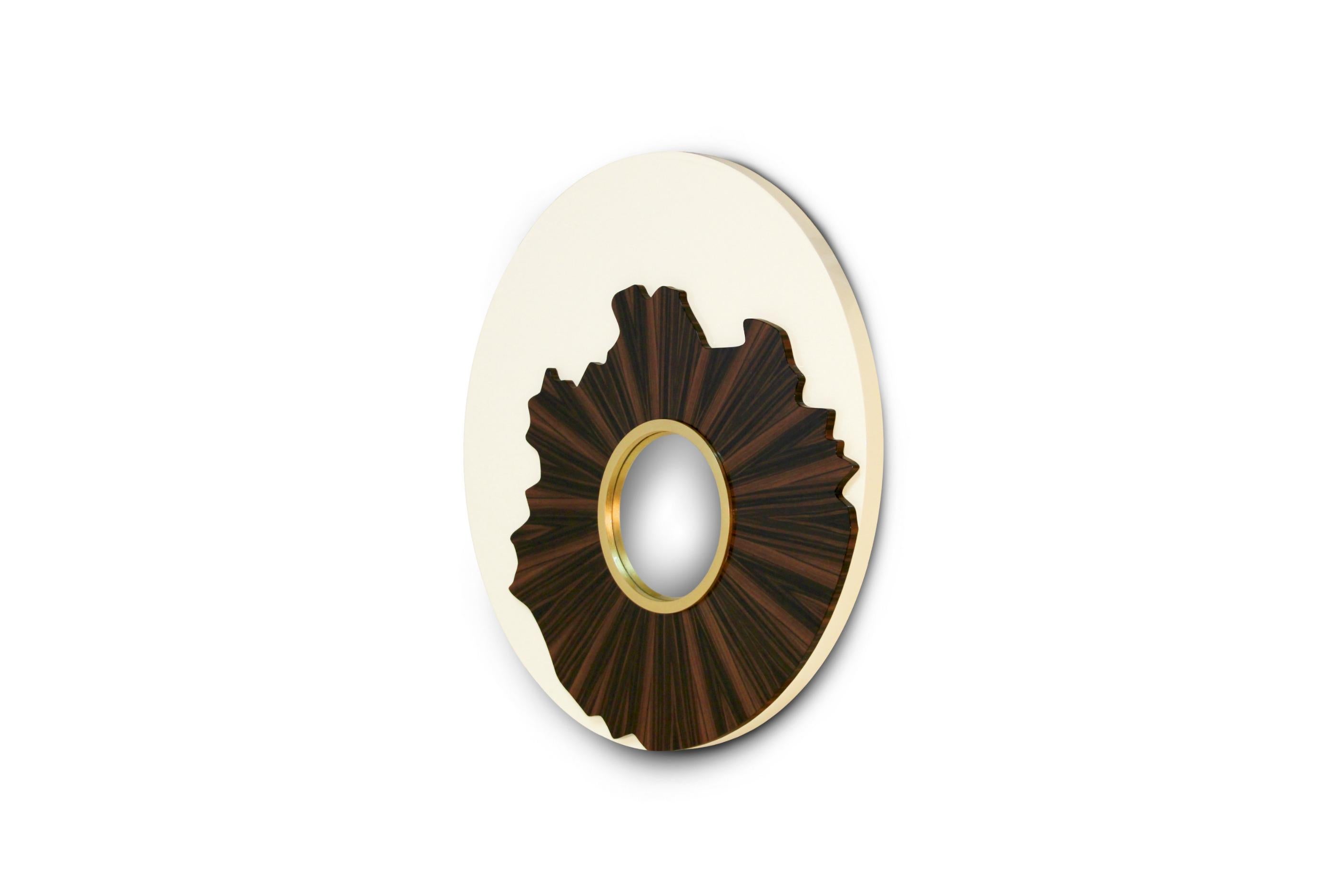 Iris is the part of the eye that changes and controls our perception of light, shapes and colours. IRIS Round Mirror enhances all these features through its structure in lacquer, palisander wood veneer, golden leaf and convex mirror. Bring allure to