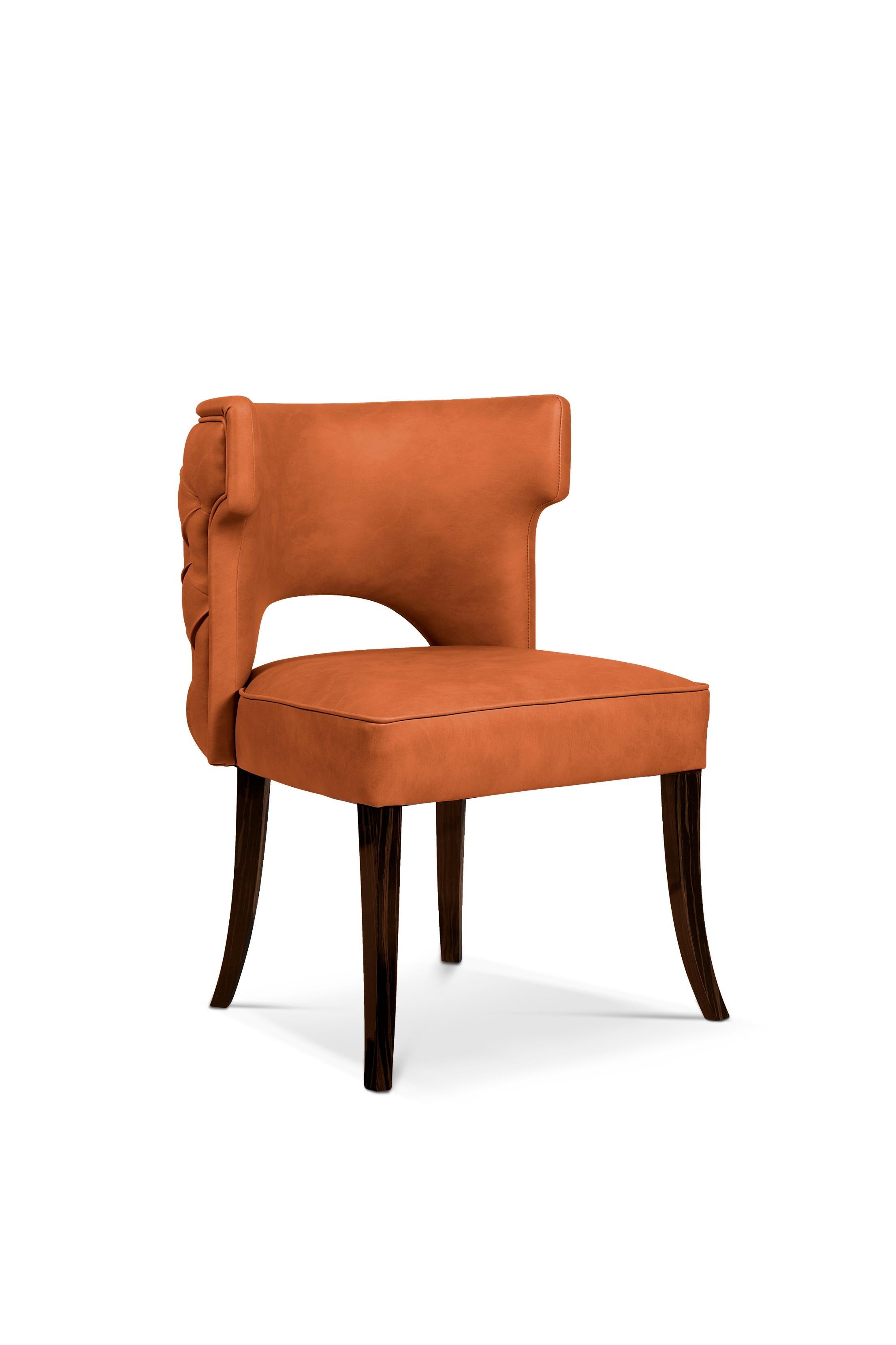 Each Spring, from 1866-1885, cowboys drove from Texas to railheads in Kansas. Kansas dining chair is a tribute to their courage. This button-tufted back chair is upholstered in Faux Leather, making it the perfect dining room furniture