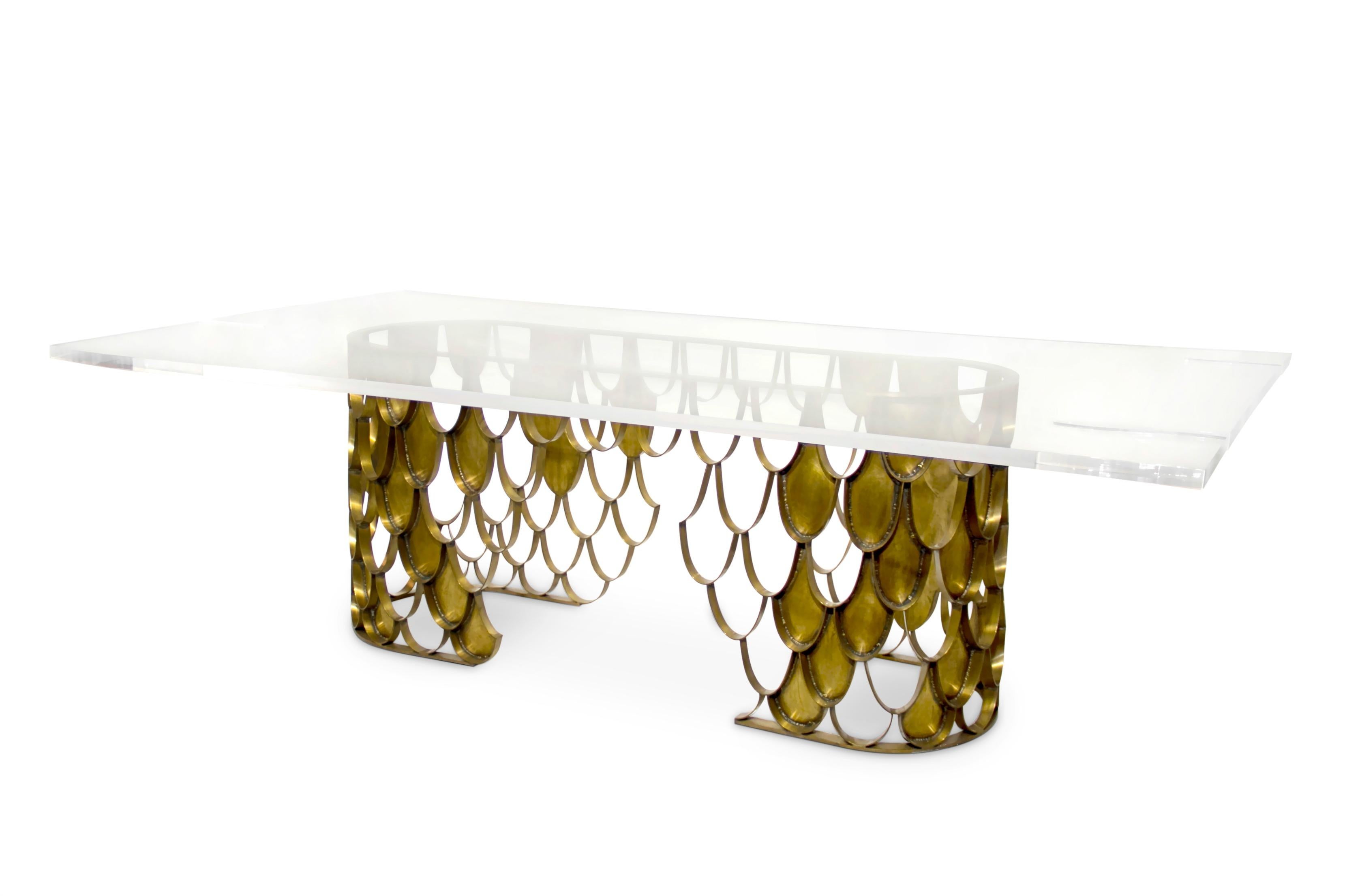 Koi carp is a recurring symbol of Japanese culture. Its natural color mutations reveal their capacity to adapt, just like KOI dining table. Featuring a base in aged brass & a top in acrylic, this rectangular dining table will add refined elegance to