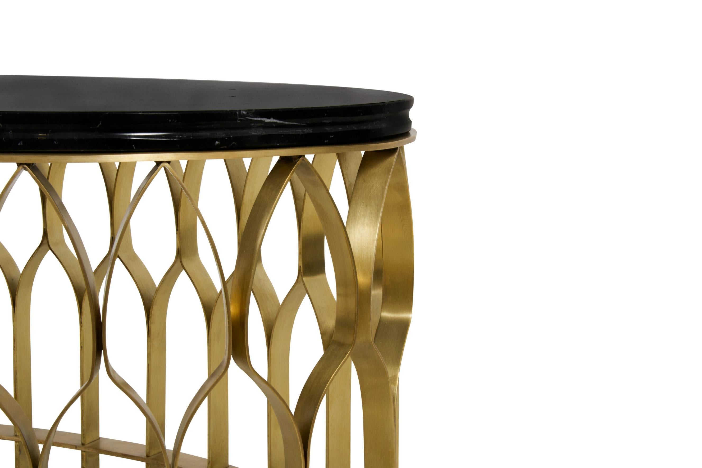 Mosques are not only places for the spiritual cult but also majestic architectural works. MECCA Center Table features brushed aged brass matte columns that resemble the architectural heritage from the mosques. This round coffee table will enhance