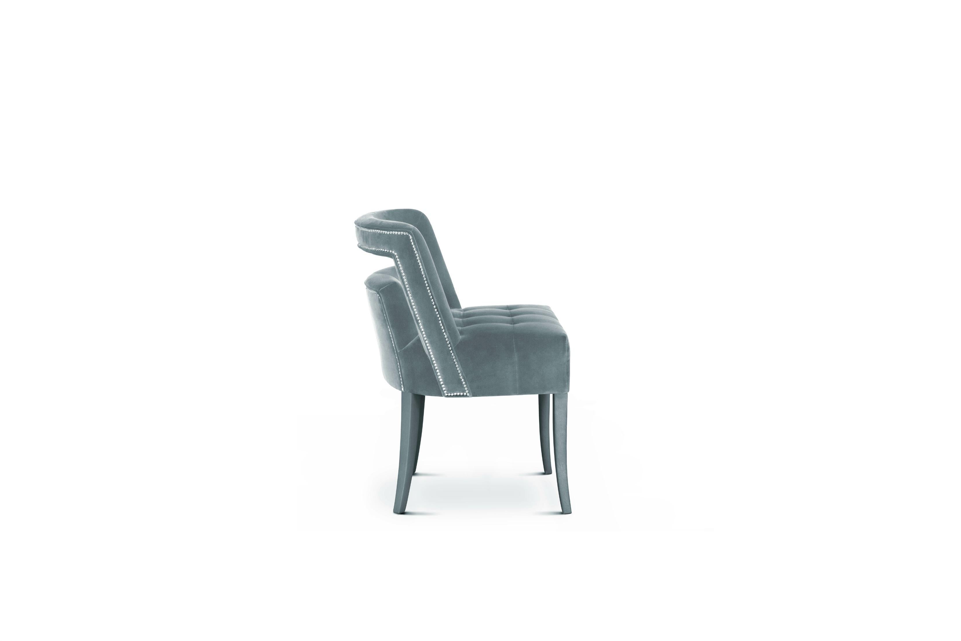 Guatemala was the stage of one of the most important discoveries in the twentieth century – the Naj Tunich. Inspired by it is NAJ Dining Chair, a dining room chair fully upholstered in cotton velvet with nickeled nails. This fabric chair is sure to