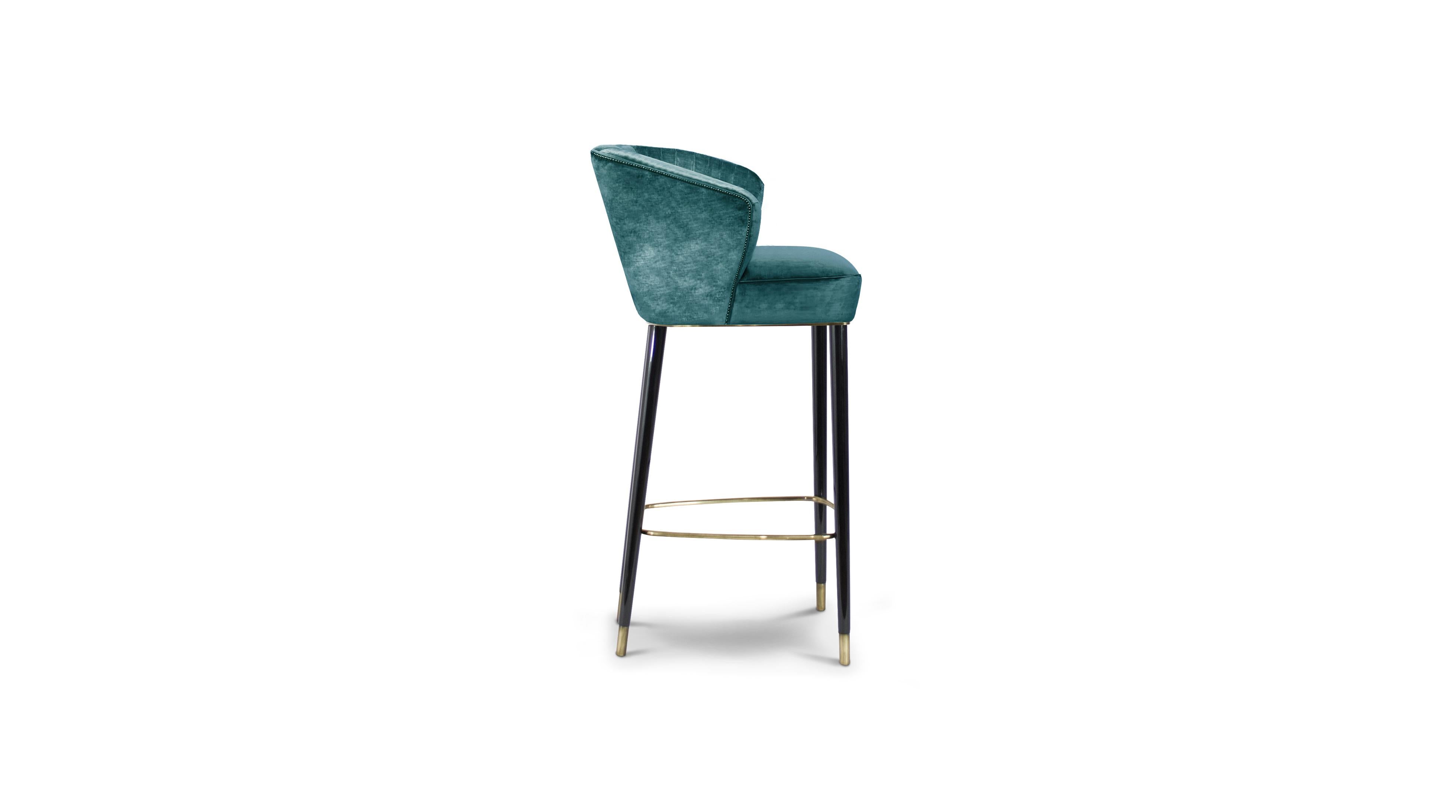 Nuka is a glacier in Alaska known for its sublime beauty. NUKA Bar Chair came to life inspired by this magnificent natural monument. Upholstered in velvet and legs in glossy black lacquered, this occasional chair with a curved back will make any bar