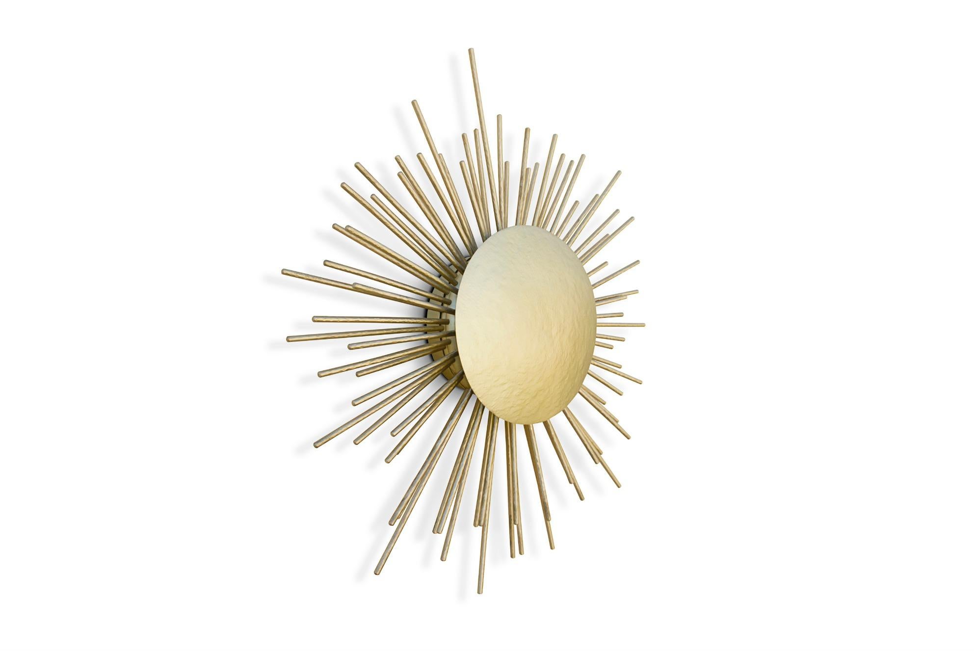 In an attempt to reinterpret the sun in a contemporary lighting piece, our designers conceived SOLEIL Wall Light. With a structure in hammered brass, this wall sconce will expand all over any room like sunlight rays. Discreet yet remarkable, SOLEIL