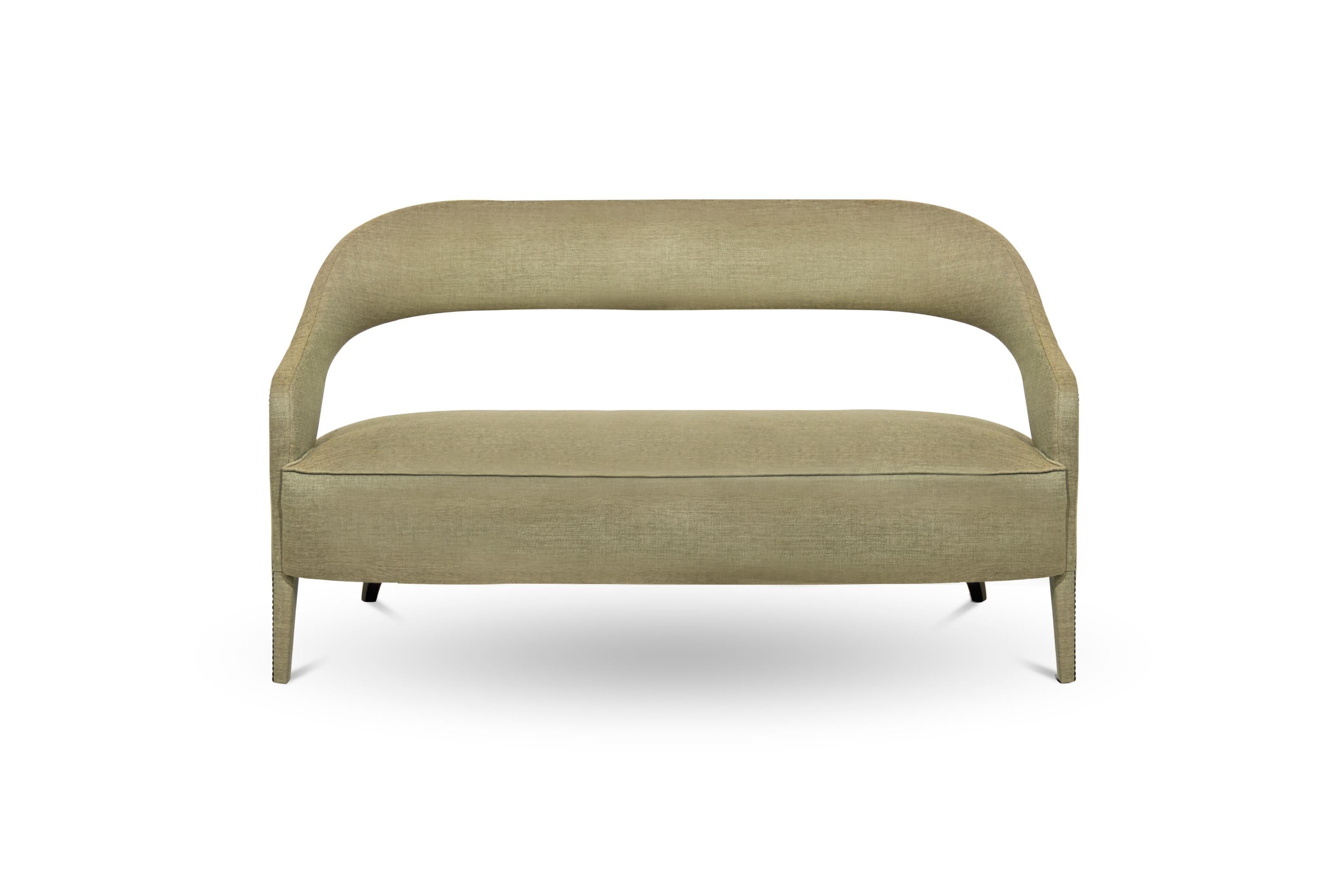 In Roman mythology, Tellus is the goddess of the Earth. TELLUS Sofa honors its deity aura. The twill fabric, nailhead trim and the back legs in matte lacquered add subtle sophistication, making this fabric sofa an elegant piece able to fit in any