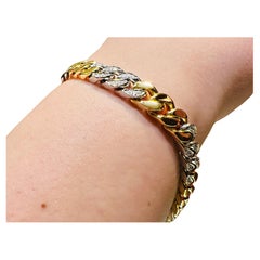 Groumette-Armband aus Weiß- und Gelbgold mit Diamanten: Kraft und Stil