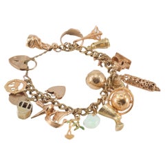 9k gold "Charms" bracelet with English charms