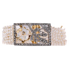 Armband aus 18 Karat Gold und 14 Karat Silber mit Süßwasserperlen und Diamanten