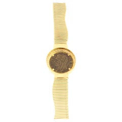 Bracelet semi-rigide en or jaune avec pièce de monnaie ancienne et diamants