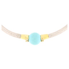 White gold semirigid bracelet with diamonds and turquoise sphere