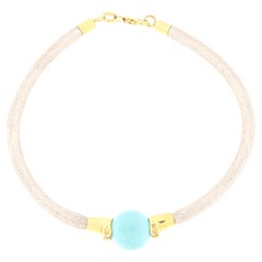 Pulsera semirrígida de oro blanco con diamantes y esfera de turquesa