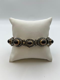 Armband im Retro-Stil aus Gelbgold und Silber, mit Diamantrosen und Granaten