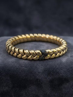 Modernes Stretch-Armband aus 18-Karat-Gelbgold mit schwarzen Diamanten, Italien