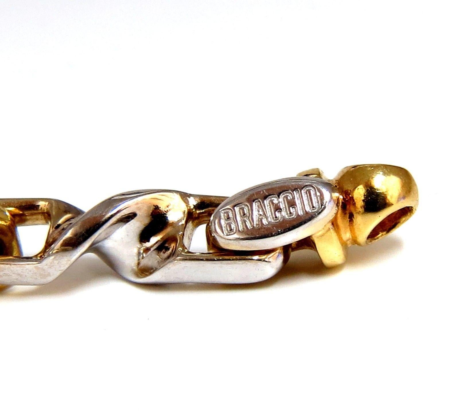 Designer: Braccio

 Two Toned Unisex Bracelet

Mod Deco

Smooth & High Shine

Unique Elongated Twisted Links

8 inch / wearable length

Comfortable locking / rotating clasp

40 Grams.

6.3mm wide

18kt yellow / white Gold.

Secure & Comfortable clasp