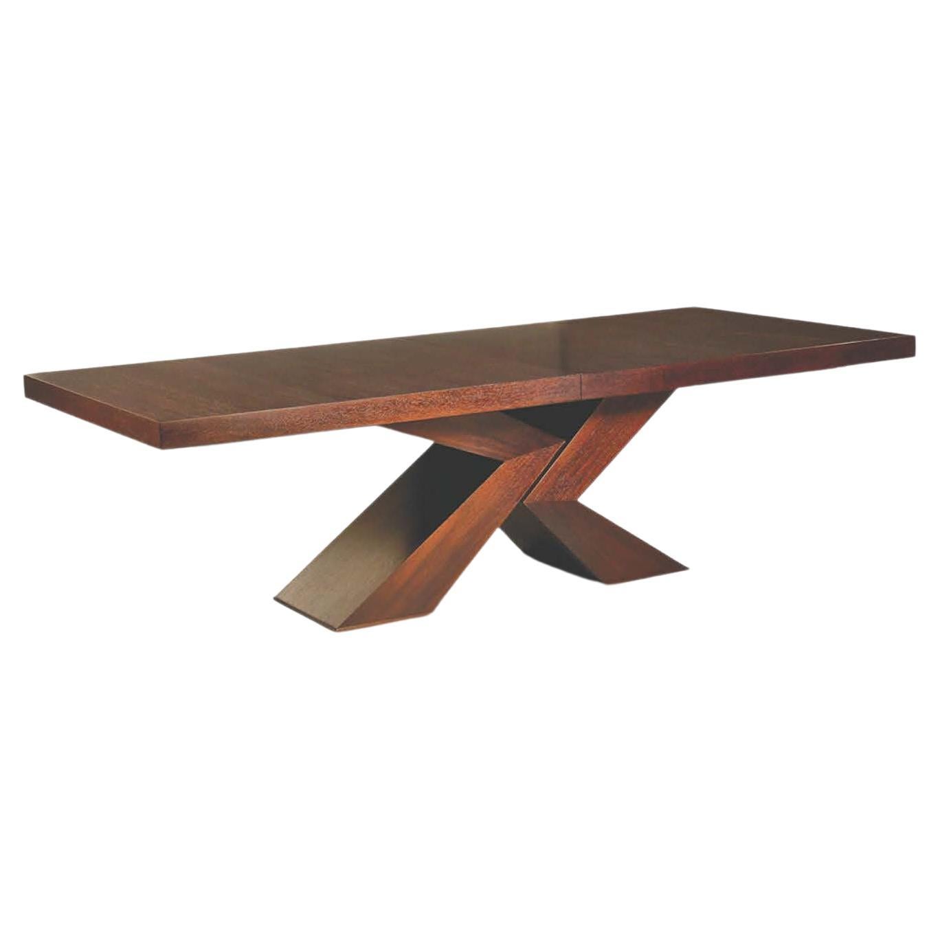 Brace Dining Table with Sculptural Table Base Shown in Chestnut Brown Mahogany 