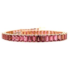 Bracelet tennis en or rose 18 carats avec tourmalines roses taille émeraude 14,94 carats