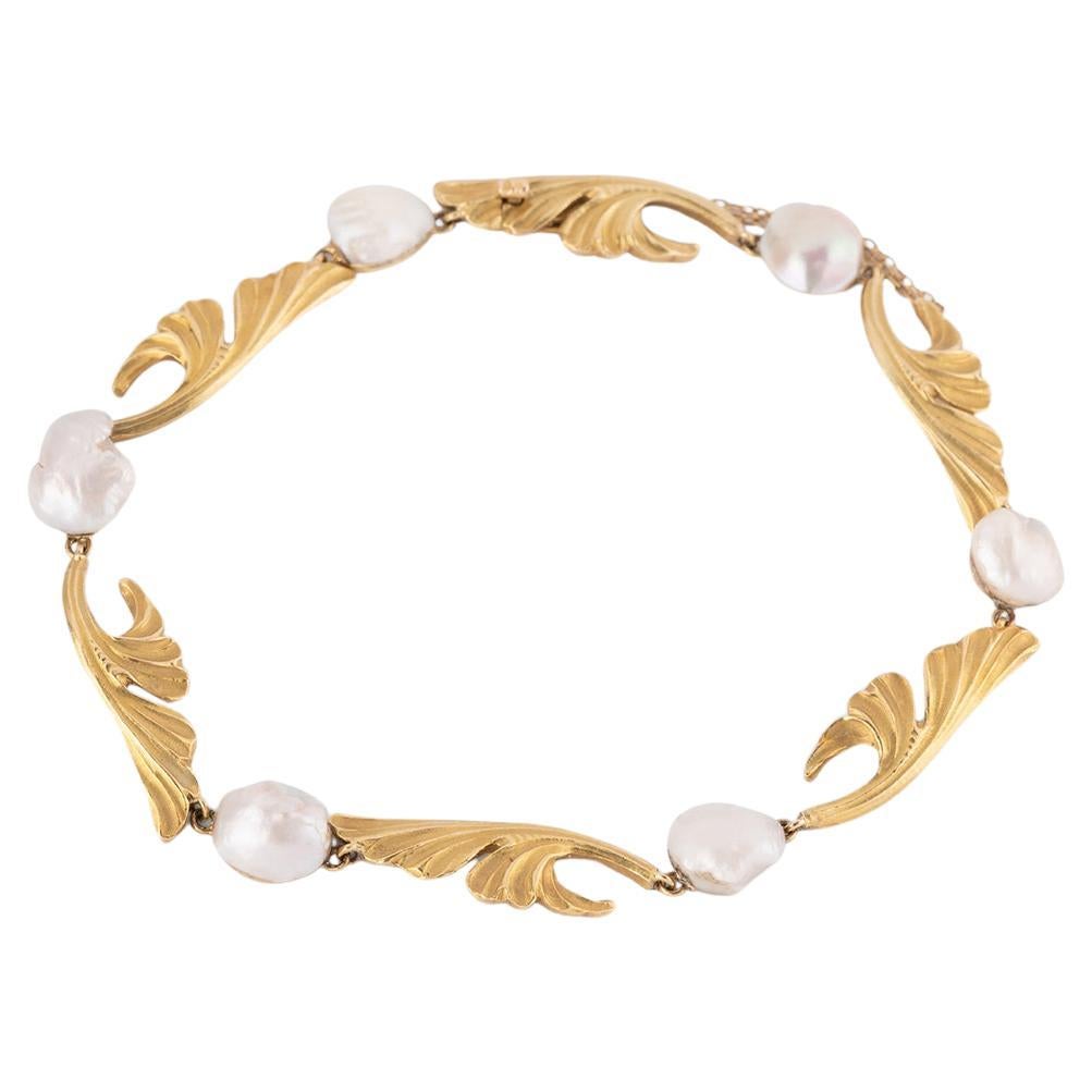 Pulsera Art nouveau à décor de gingko biloba en or et perles