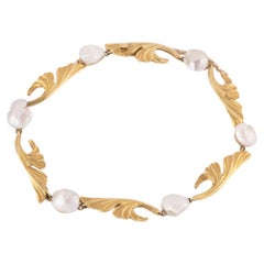 Antique Bracelet Art nouveau à décor de gingko biloba en or et perles