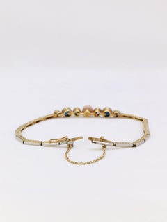 Bracelet Belle Epoque en or, perle fine bouton rosée, diamants taille ancienne e