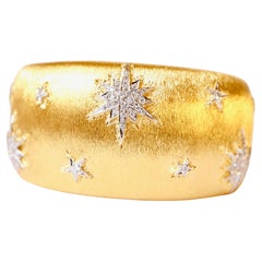 Bracelet en or jaune et blanc 18 carats avec étoiles ou flocons de neige et diamants