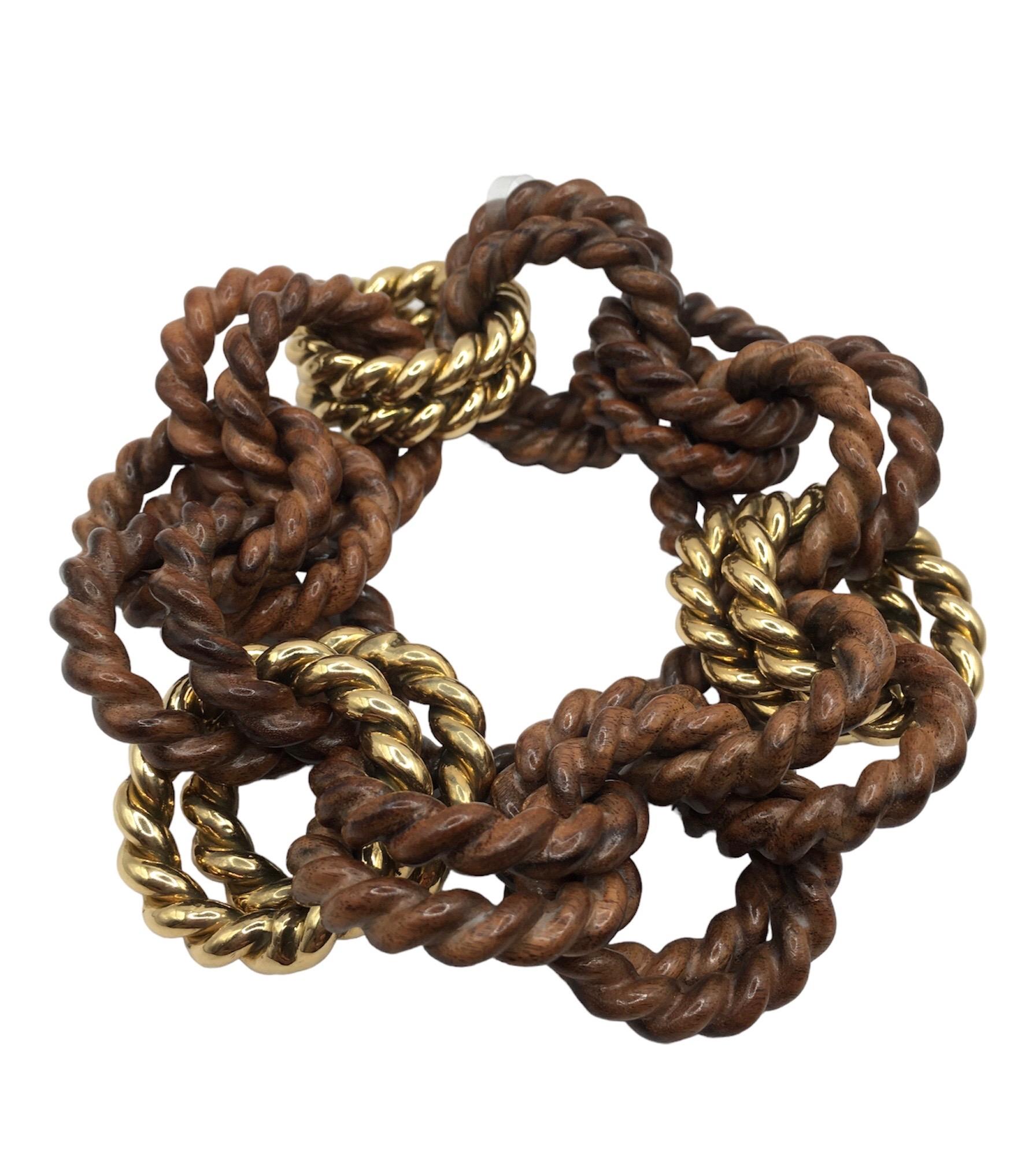 Rope links bracelet  in 18 kt  yellow gold and rose wood
This is a traditional piece  in Micheletto production

the total weight of the gold is  gr 36.40

STAMP: 10 MI ITALY 750

The full set is available