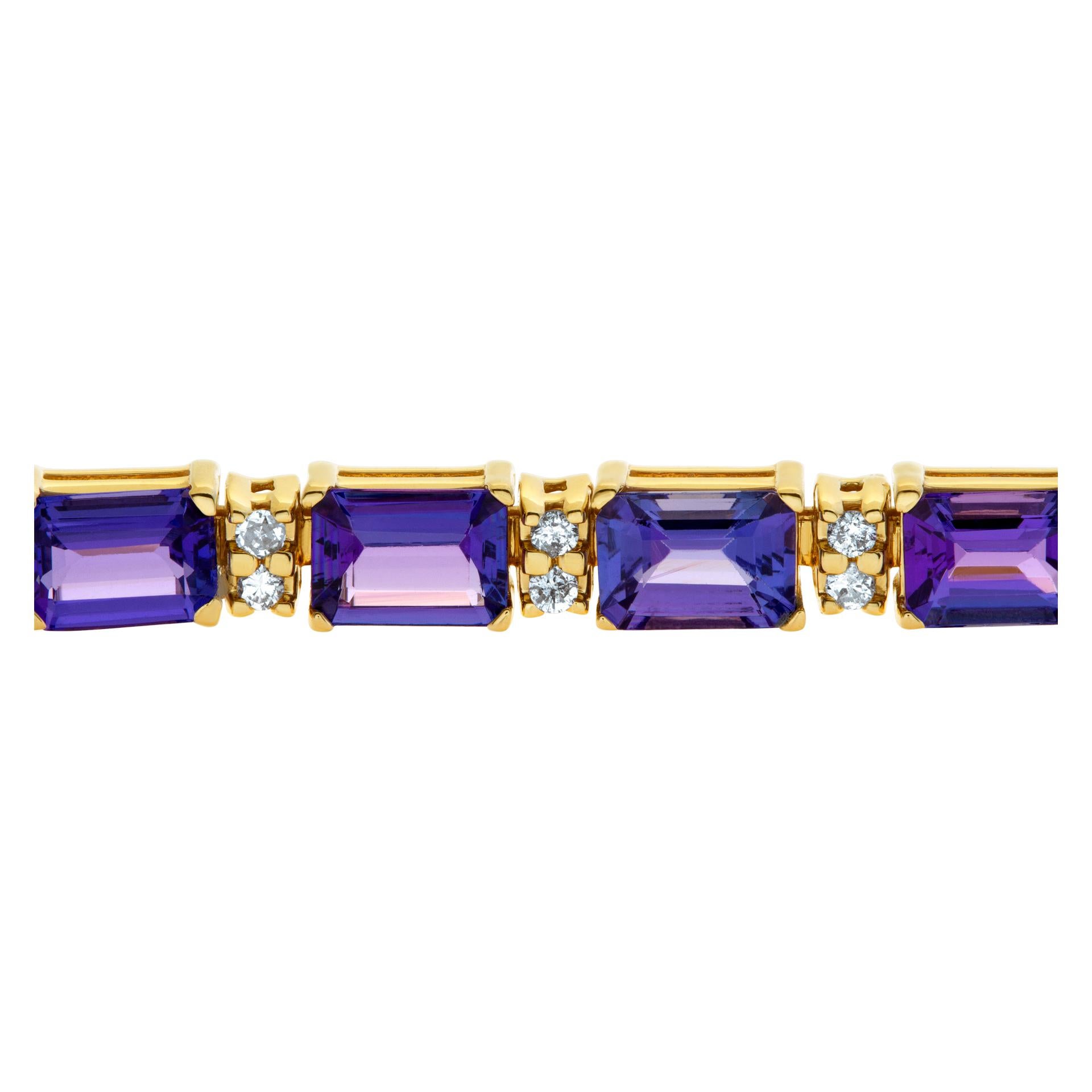 14k bracelet with 16.8 cts Emerald cut Tanzanite and 8 carats full cut round brilliant diamonds. 7 inches long x 5mm wide.
