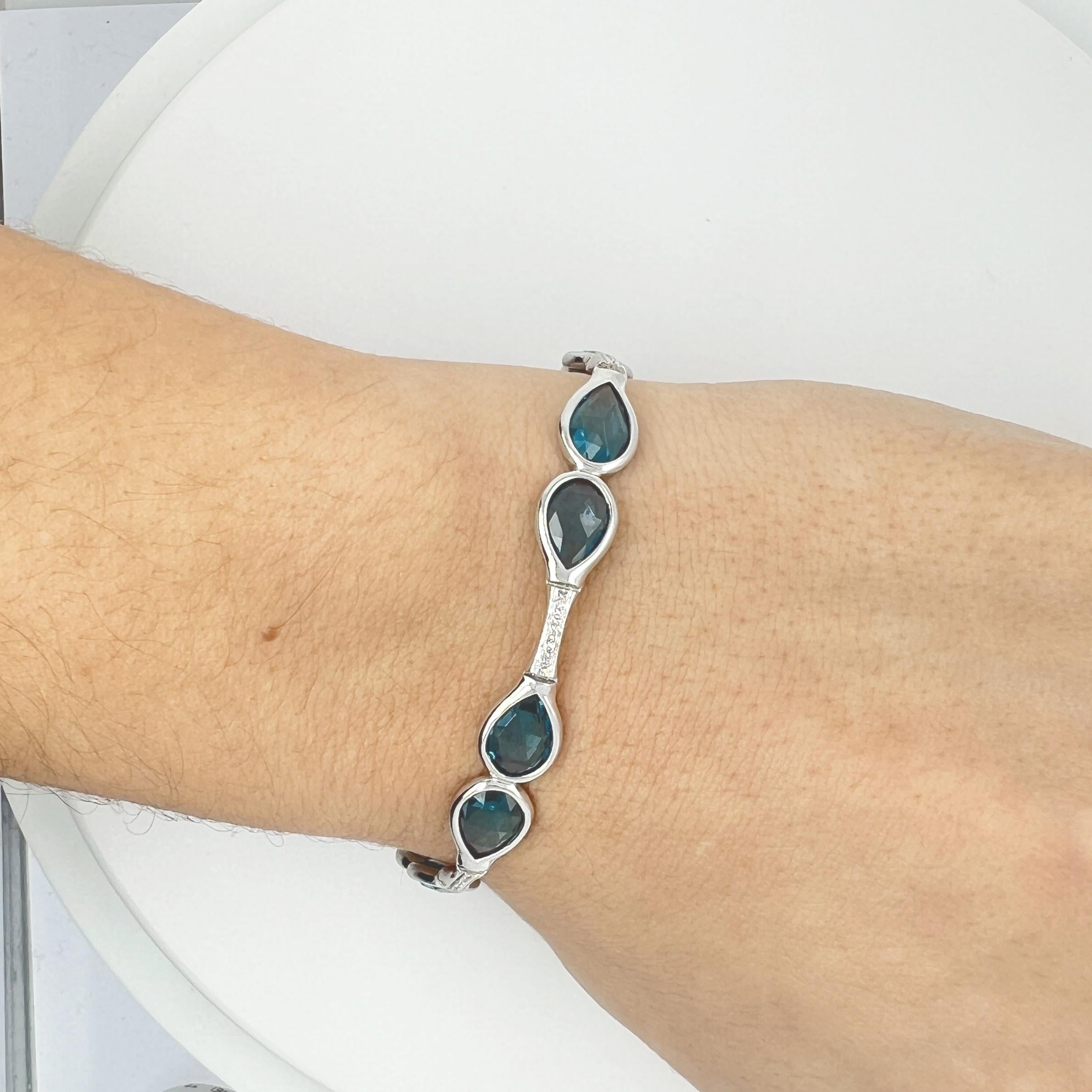 Brilliant Cut Bracelet in 18k gold with Diamonds and Blue Topaz drops For Sale
