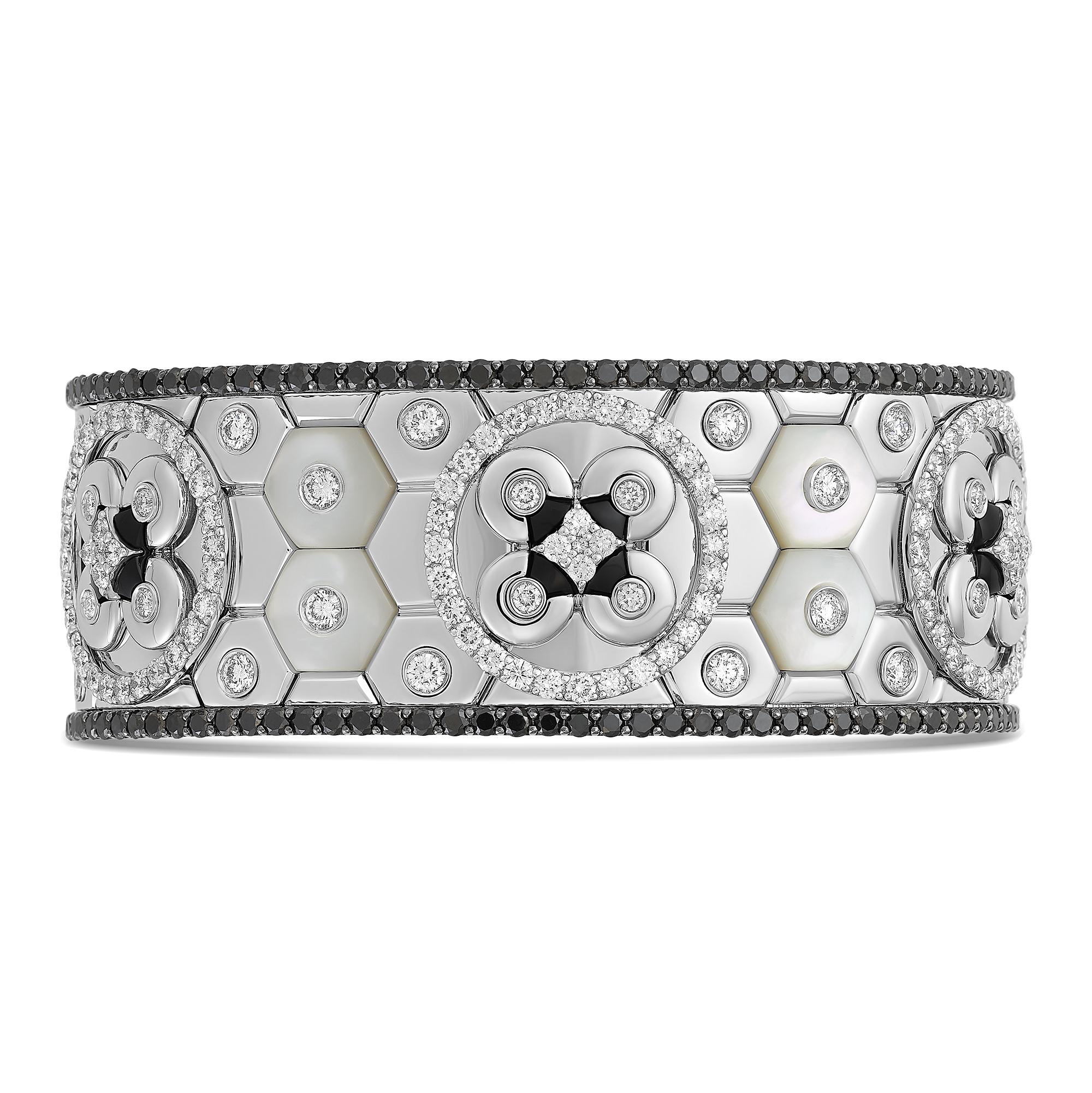 Bracelet in 18K white gold (approx. 114.23 grams) with white and black diamonds (approx. 11.12 carats) , mother of pearl and onyx (approx. 3.70 grams). Inspired by the polychrome mosaics now submerged in Capo Miseno's bay near Naples, Italy.

From