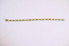 Pulsera de Oro Amarillo de 18 quilates, 18 Zafiros por 4,02 Kt Esmeraldas 2,94 Kt Diamantes