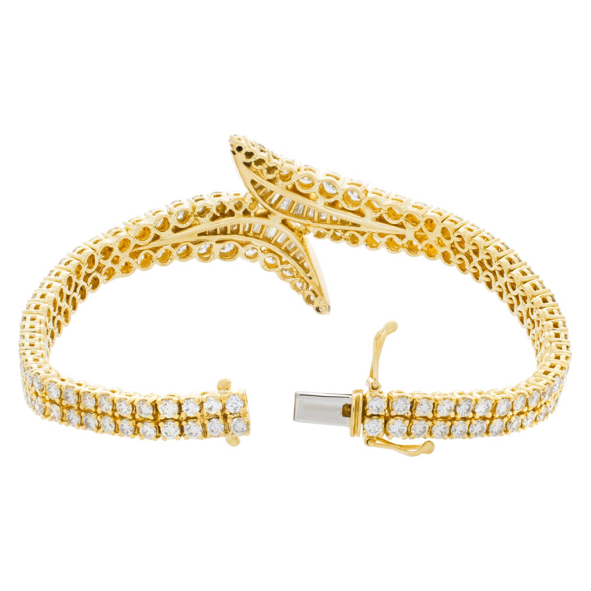 Breathtaking diamond bracelet in 18k yellow gold with over 9 carats in full cut round brilliant and baguette diamonds.
Stones are G-H color, VVS-VS clarity.
Length 7 inches