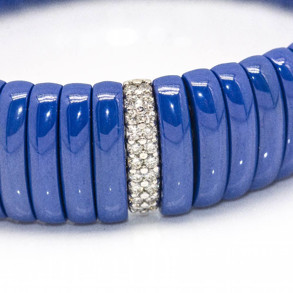 JARRETIERE Elastic Bracelet in White Gold with Diamonds and blue ceramic for women : 12x Brilliant cut Diamonds in G/VS quality : 18 kt. White Gold : 60,40 grams : Solid : Elastic bracelet does not need a clasp : Measures: Mesh width 1,4 cm,