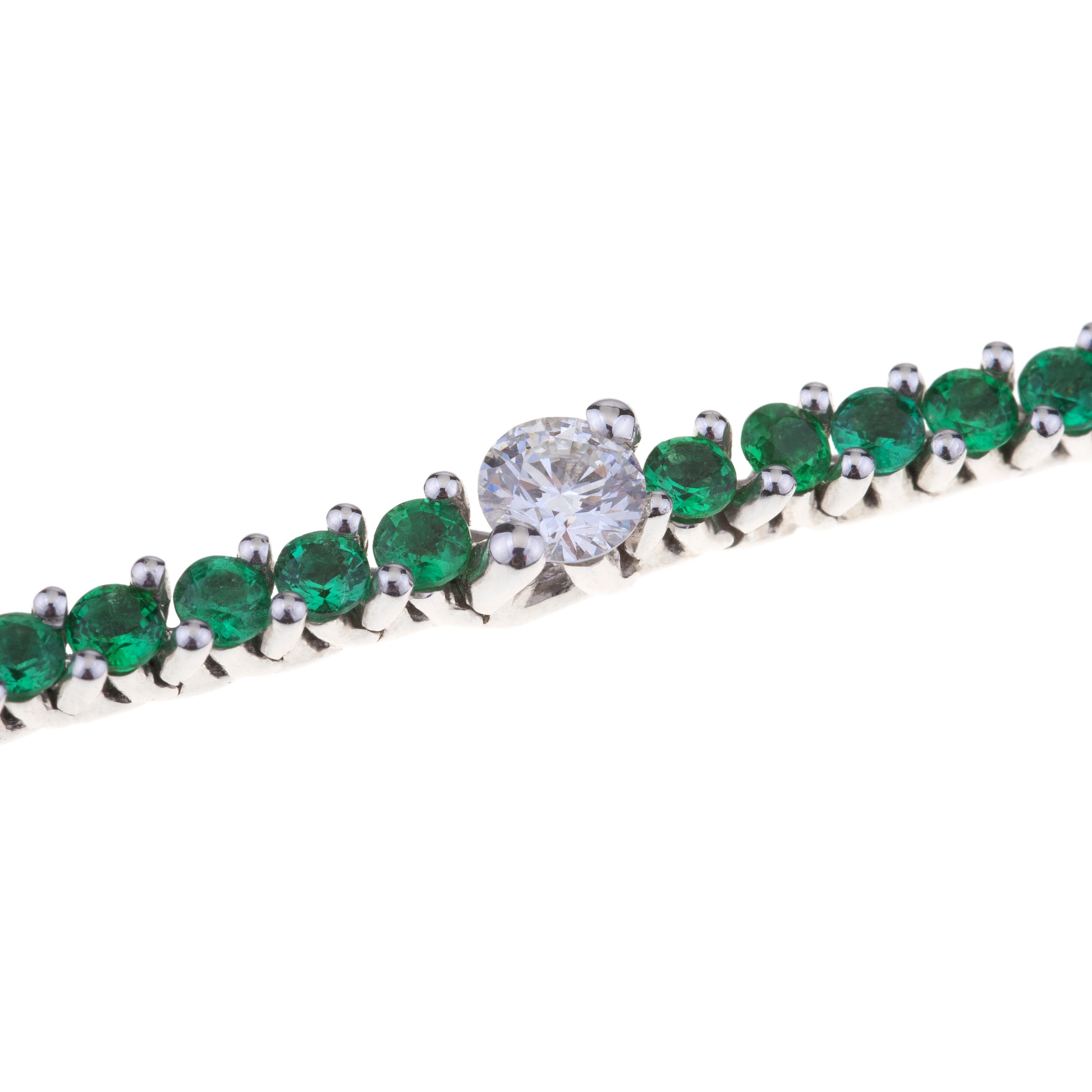 Bracelet Tennis with Emeralds and Diamonds White Gold.
Classic Tennis Bracelet with Emeralds ct. 2.85 and Seven Larger Diamonds ct. 1.57.
Lenght is cm. 18. 18kt gold grams are  13.8.
Designed in Italy.
Angeletti Boasts an Exceptional History Made of