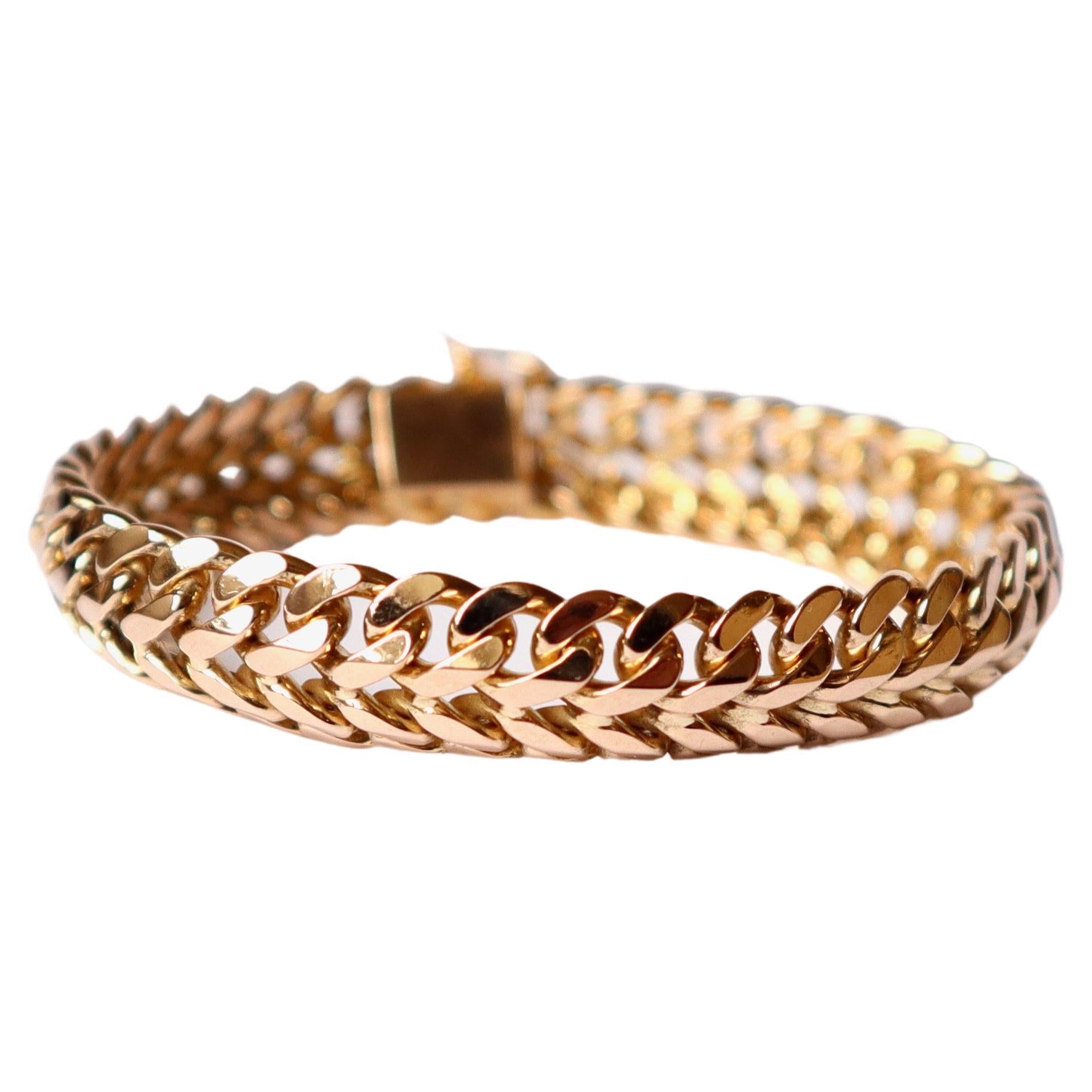 Bracelet Vintage double curb links Gourmette circa 1960 in 18 Kt yellow gold (750 mil.)
Safety clasp.
Weight: 53.5 g 
Length: 19cm Width: 1.2cm. 
Eagle head hallmark and maker's mark.
French Work from the 60's