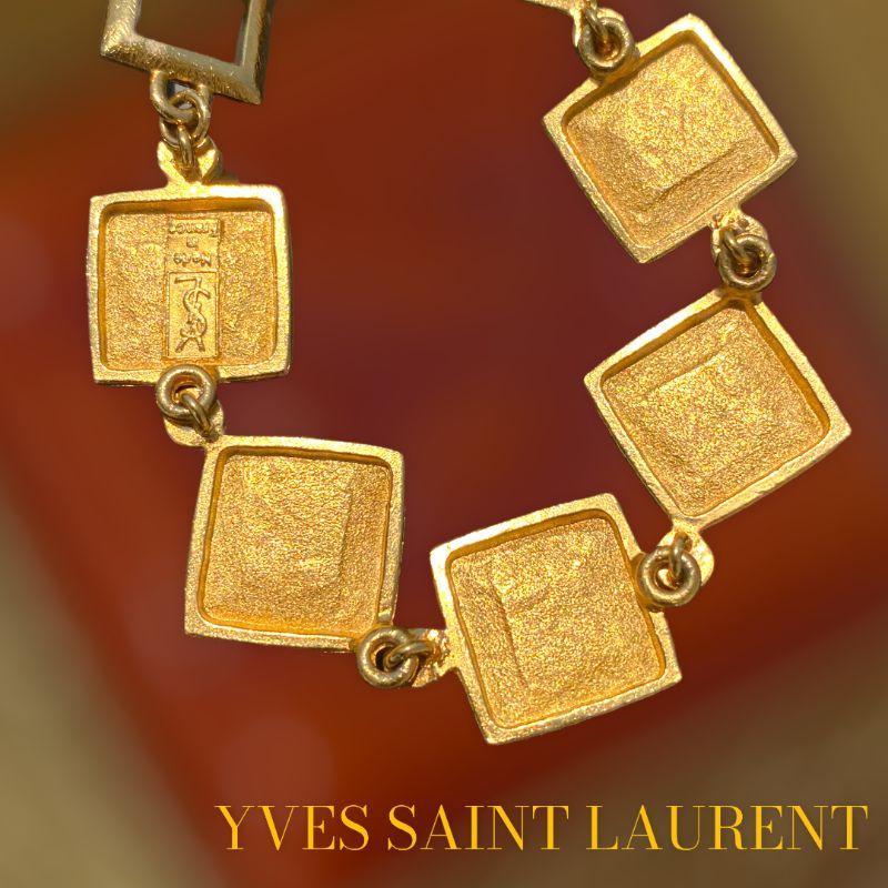 Vintage YVES SAINT LAURENT bracelet, never worn. matte golden brushed orange, e.g. It has never been worn, possibility of matching earrings and ring.
