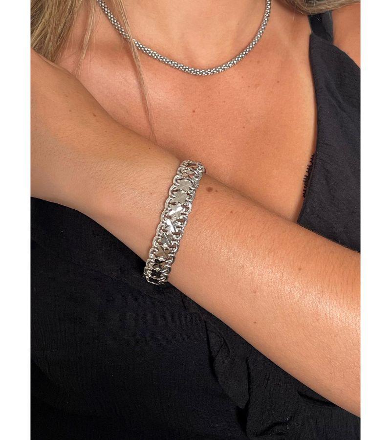 Bracelet in white gold 750 thousandths (18 carats). fancy mesh. length: 19 cm. width: 1.40 cm. total weight: 25.24 g. eagle head hallmark. excellent condition.

