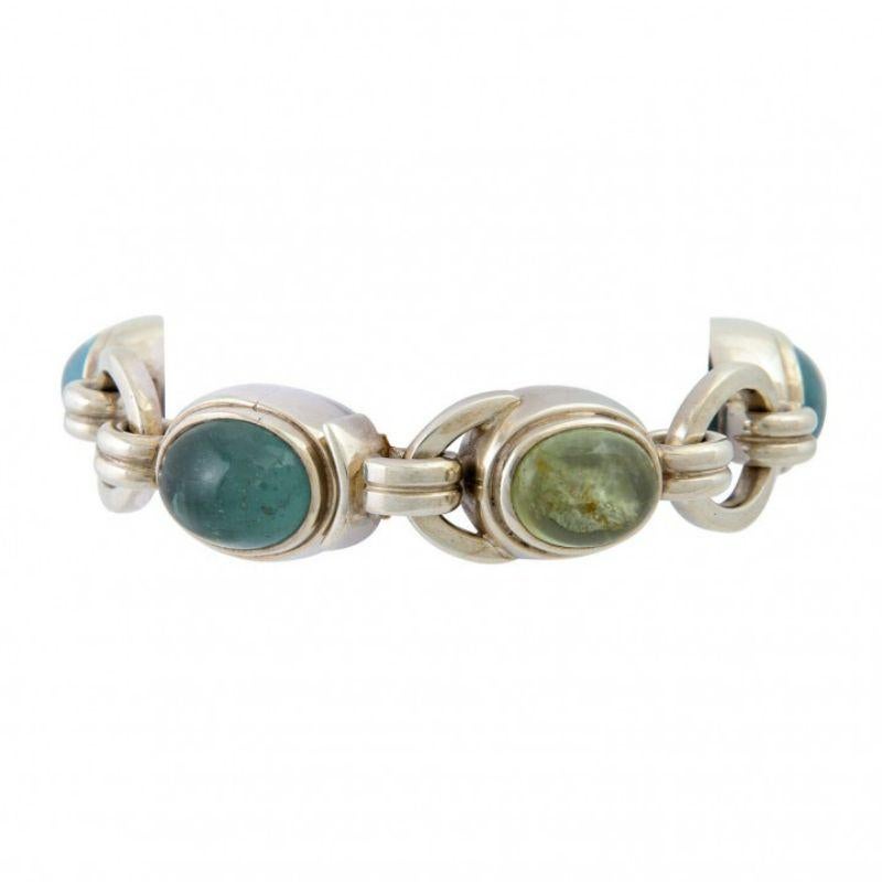 Bracelet with 5 oval beryl/aquamarine cabochons, silver, 91 g, L: 21 cm, price (2018): 1,820 €, hand-made, good condition, proof of purchase enclosed.

Bracelet with 5 oval cabochons- cut beryl/aquamarines, silver 91 g, L: 21 cm, PP (2018): 1,820 €,