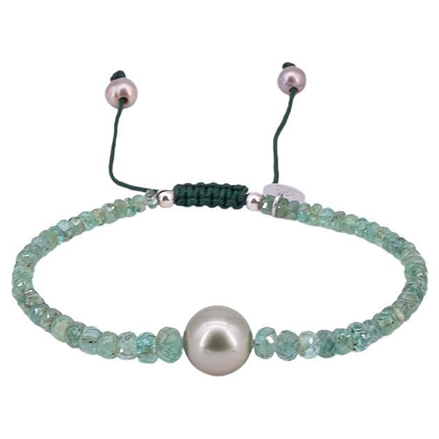 Bracelet with about 16 carat emeralds, one Tahiti pearl and drawstring closure For Sale