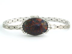 Bracelet with black opal and brilliant cut diamonds up to 0.50ct 14k gold